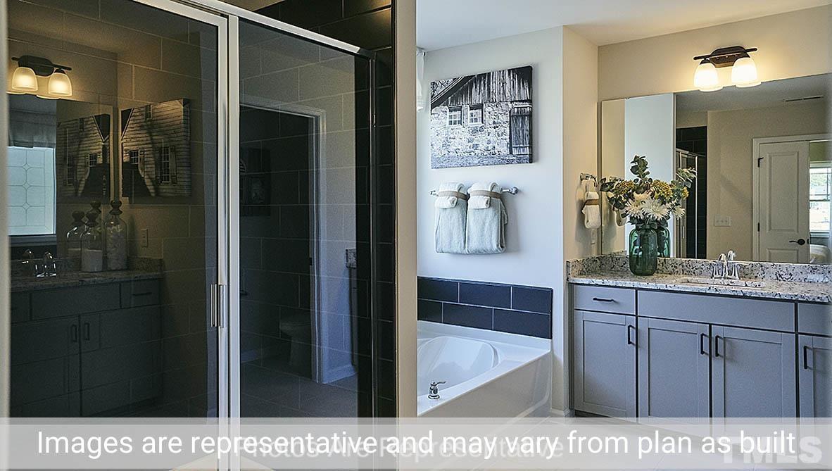 7704 Calcutta Drive Willow Spring, NC 27592 - Photo 29 of 30 a bathroom with a sink and a mirror