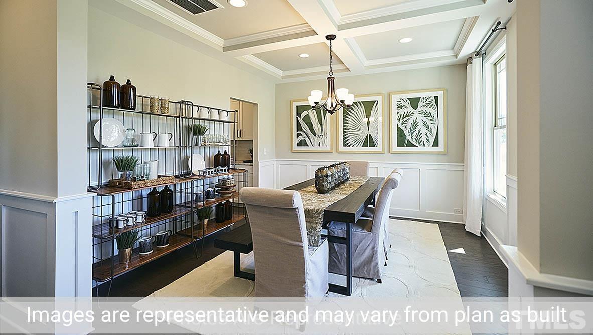 7704 Calcutta Drive Willow Spring, NC 27592 - Photo 4 of 30 a dining room with furniture and window