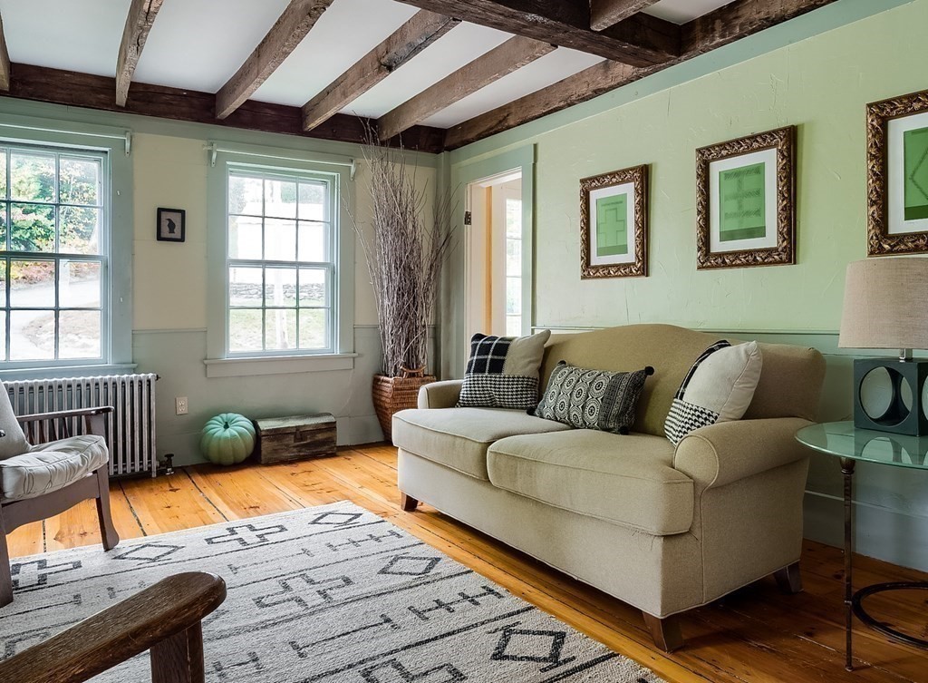 92 Mountain Road Princeton, MA 01541 - Photo 8 of 42 a living room with furniture a window and wooden floor