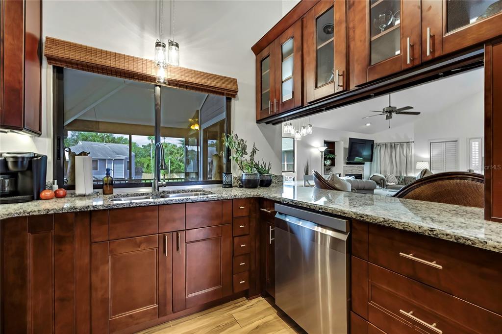 2919 North Rivers Edge Boulevard, Unit 2919 Crystal River, FL 34429 - Photo 14 of 36 a kitchen with stainless steel appliances granite countertop a sink a stove and cabinets