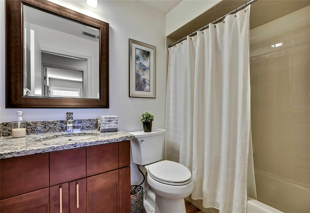 2919 North Rivers Edge Boulevard, Unit 2919 Crystal River, FL 34429 - Photo 17 of 36 a bathroom with a toilet a sink and a mirror