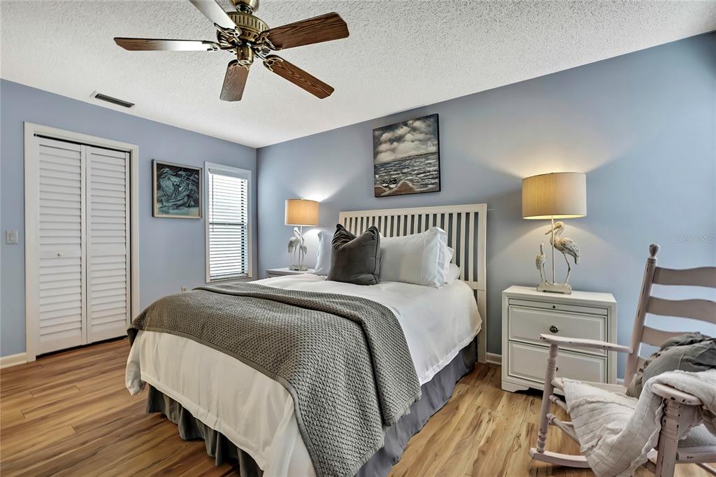 2919 North Rivers Edge Boulevard, Unit 2919 Crystal River, FL 34429 - Photo 19 of 36 a bedroom with a bed and a table