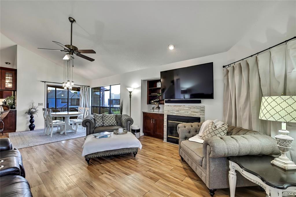 2919 North Rivers Edge Boulevard, Unit 2919 Crystal River, FL 34429 - Photo 2 of 36 a living room with furniture and a flat screen tv