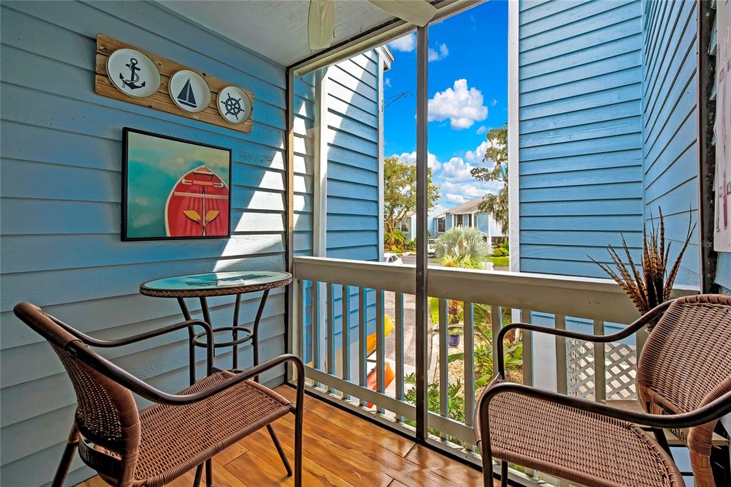 2919 North Rivers Edge Boulevard, Unit 2919 Crystal River, FL 34429 - Photo 24 of 36 a view of a chairs and table in the balcony