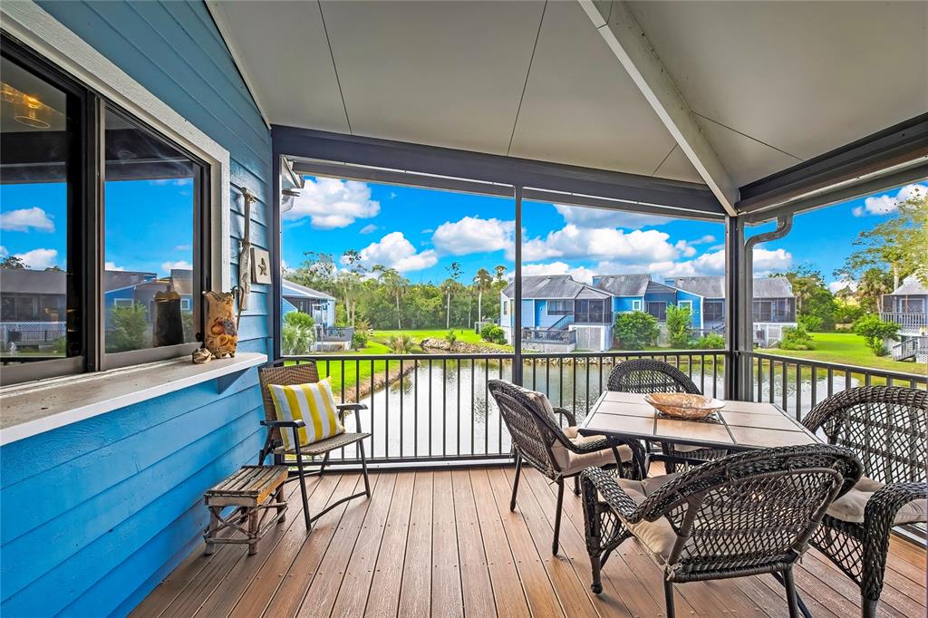 2919 North Rivers Edge Boulevard, Unit 2919 Crystal River, FL 34429 - Photo 25 of 36 a view of a balcony with furniture and wooden floor