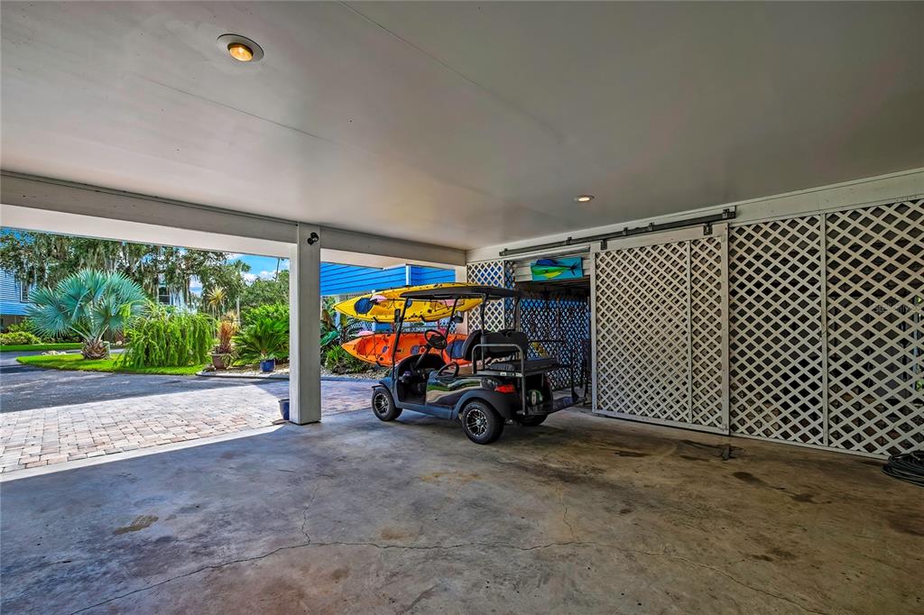 2919 North Rivers Edge Boulevard, Unit 2919 Crystal River, FL 34429 - Photo 28 of 36 a view of a garage with parked cars