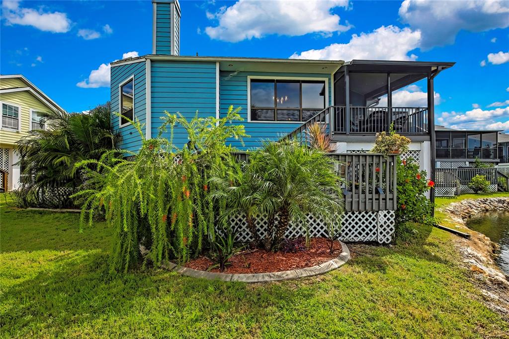 2919 North Rivers Edge Boulevard, Unit 2919 Crystal River, FL 34429 - Photo 35 of 36 a front view of a house with garden