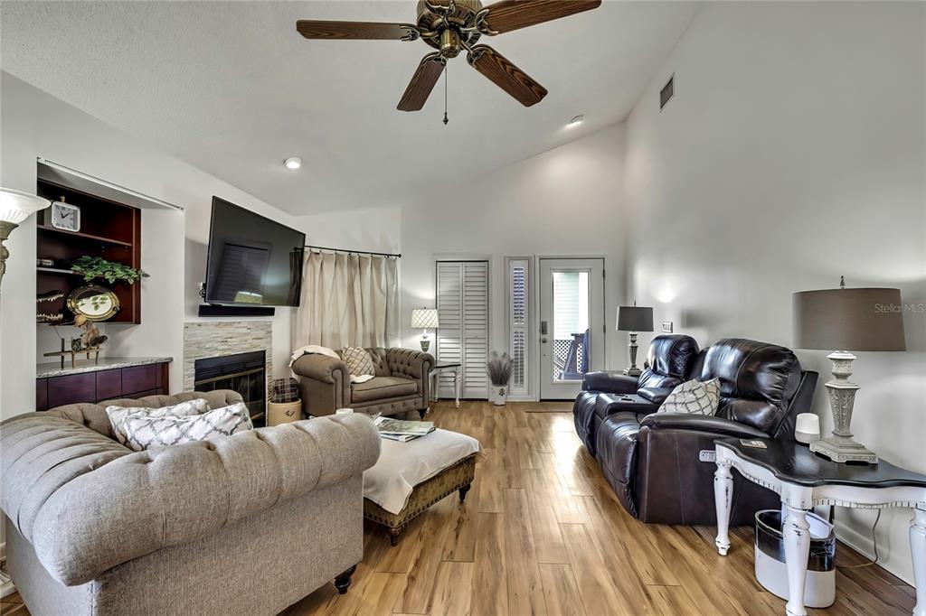 2919 North Rivers Edge Boulevard, Unit 2919 Crystal River, FL 34429 - Photo 4 of 36 a living room with furniture and a flat screen tv