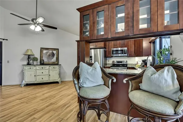a living room with furniture and a floor to ceiling window
