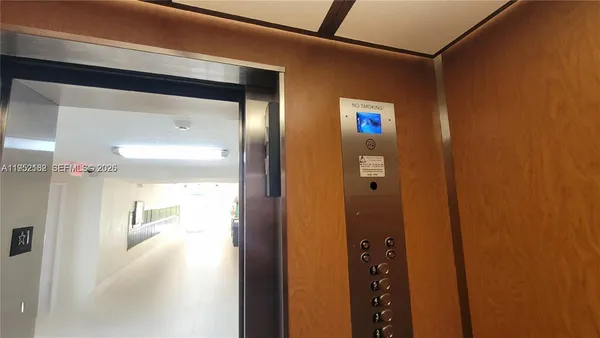 a kitchen with stainless steel appliances a stove and a microwave