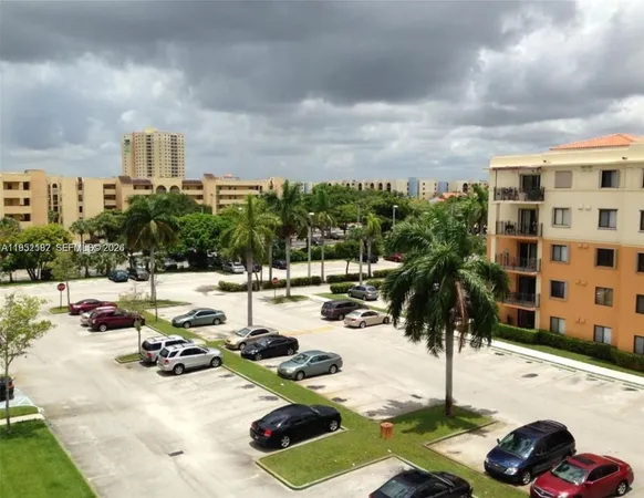 a front view of a house with fountain and a garden