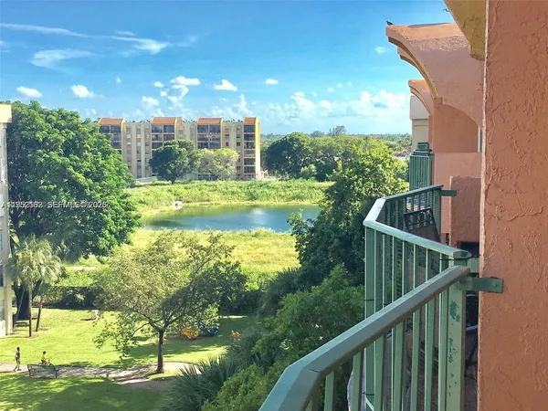 a view of swimming pool from a balcony