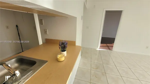 a view of kitchen island with cabinets