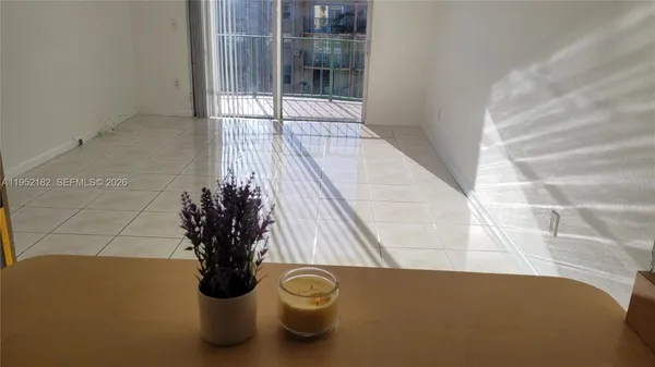 a vase of flowers sitting on a floor