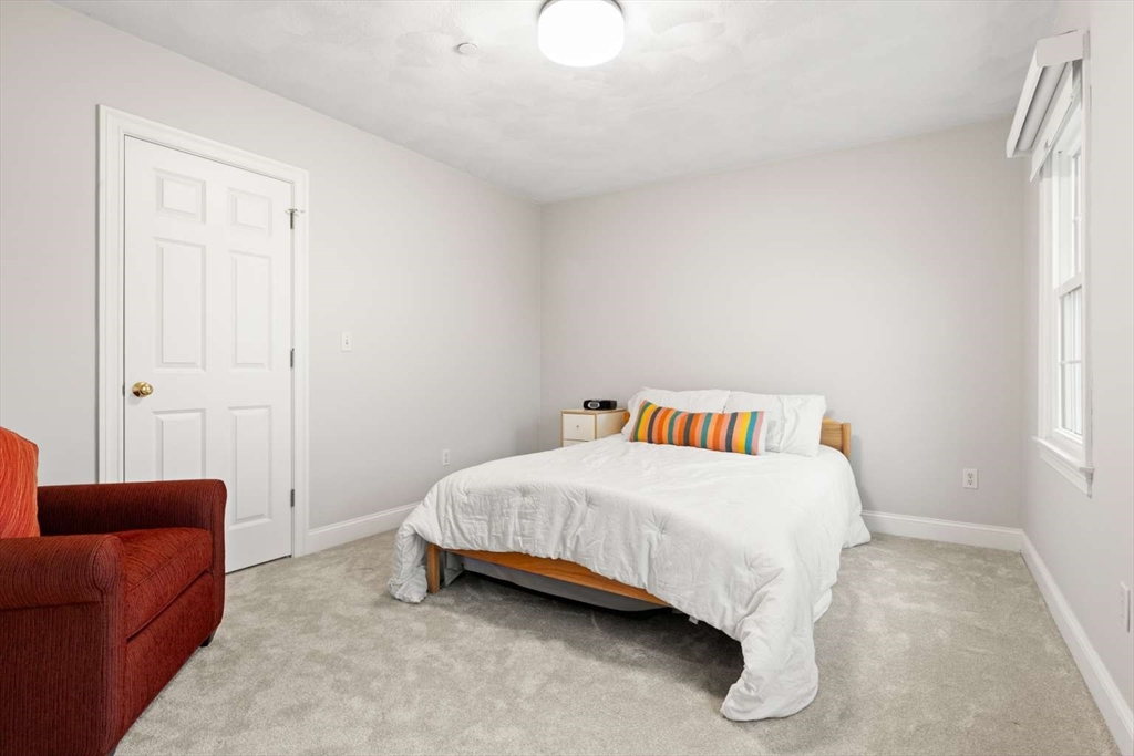 85 Windkist Farm Road North Andover, MA 01845 - Photo 18 of 20 a bedroom with a bed and a couch