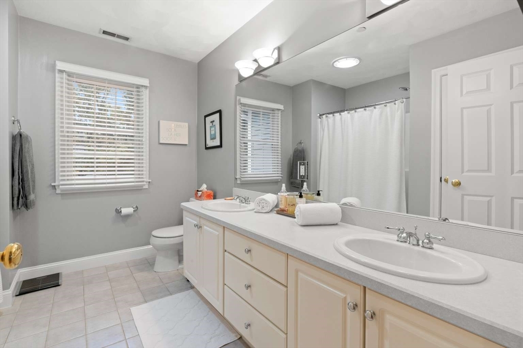 85 Windkist Farm Road North Andover, MA 01845 - Photo 20 of 20 a bathroom with double vanity sink a mirror and a toilet