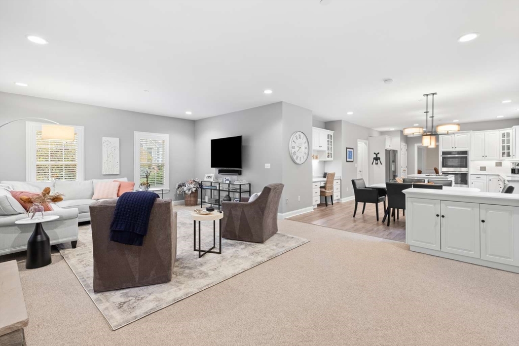 85 Windkist Farm Road North Andover, MA 01845 - Photo 7 of 20 a large living room with stainless steel appliances kitchen island granite countertop a large window and a view of living room
