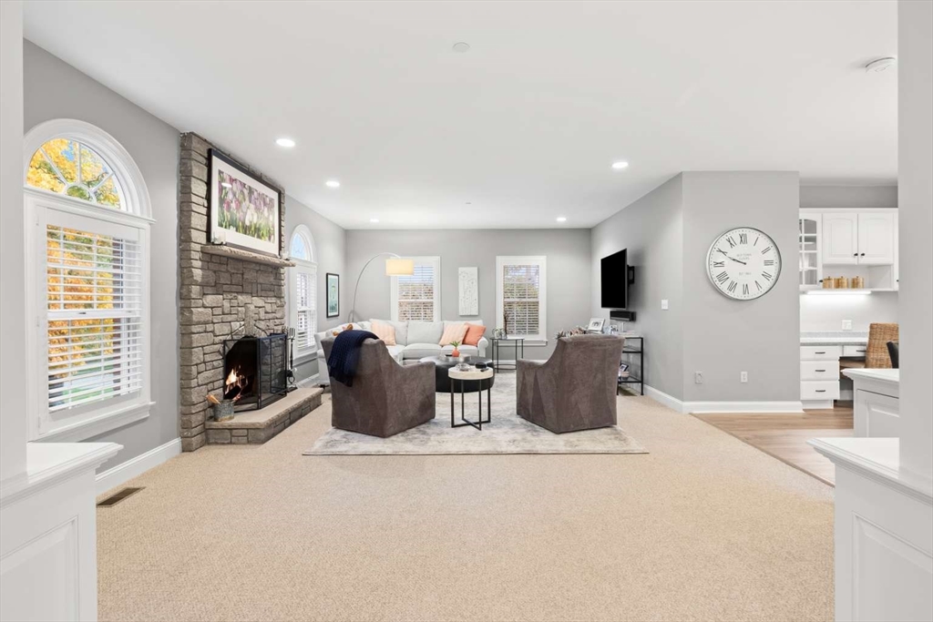 85 Windkist Farm Road North Andover, MA 01845 - Photo 8 of 20 a living room with furniture a fireplace and a window
