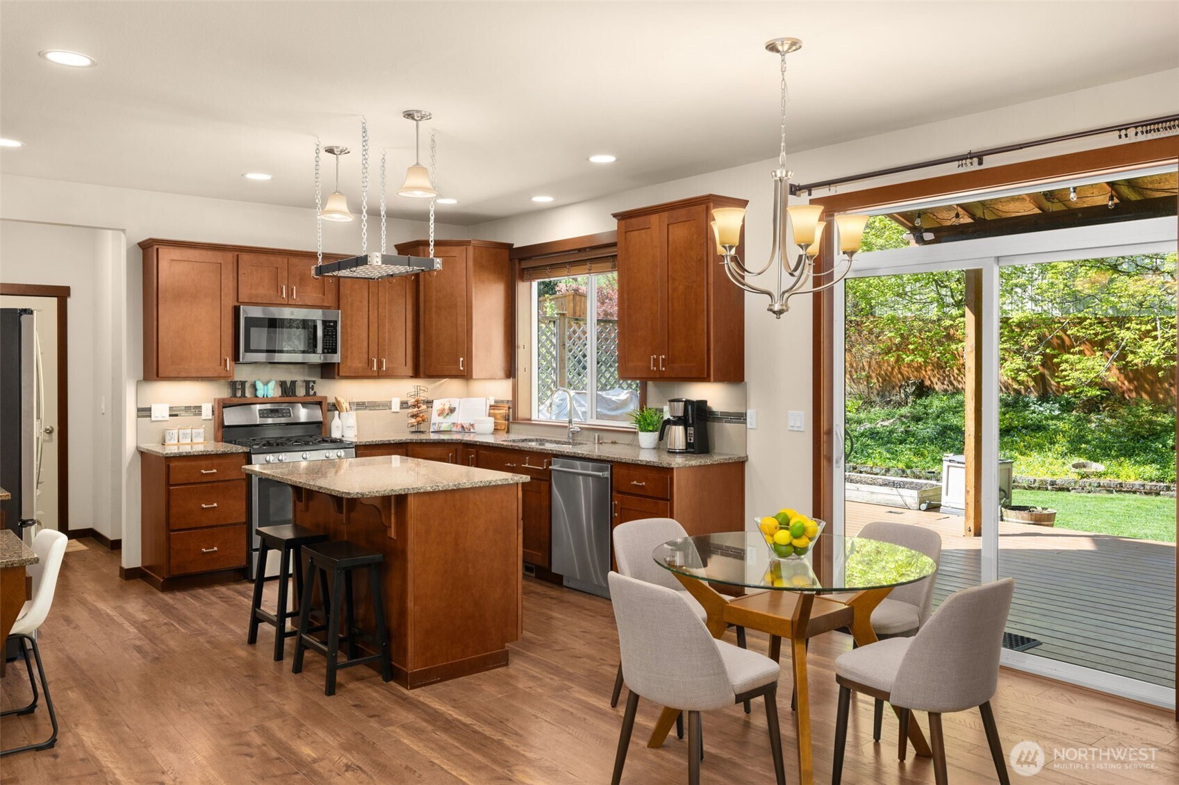 4610 Maltby Road Bothell, WA 98021 - Photo 11 of 39 a kitchen with kitchen island a large window and cabinets