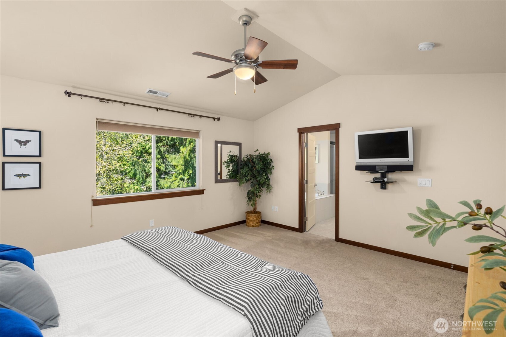 4610 Maltby Road Bothell, WA 98021 - Photo 18 of 39 a bedroom with a bed and a flat screen tv