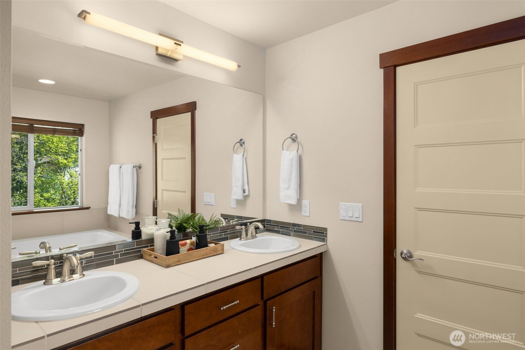 4610 Maltby Road Bothell, WA 98021 - Photo 19 of 39 a bathroom with a sink and a mirror
