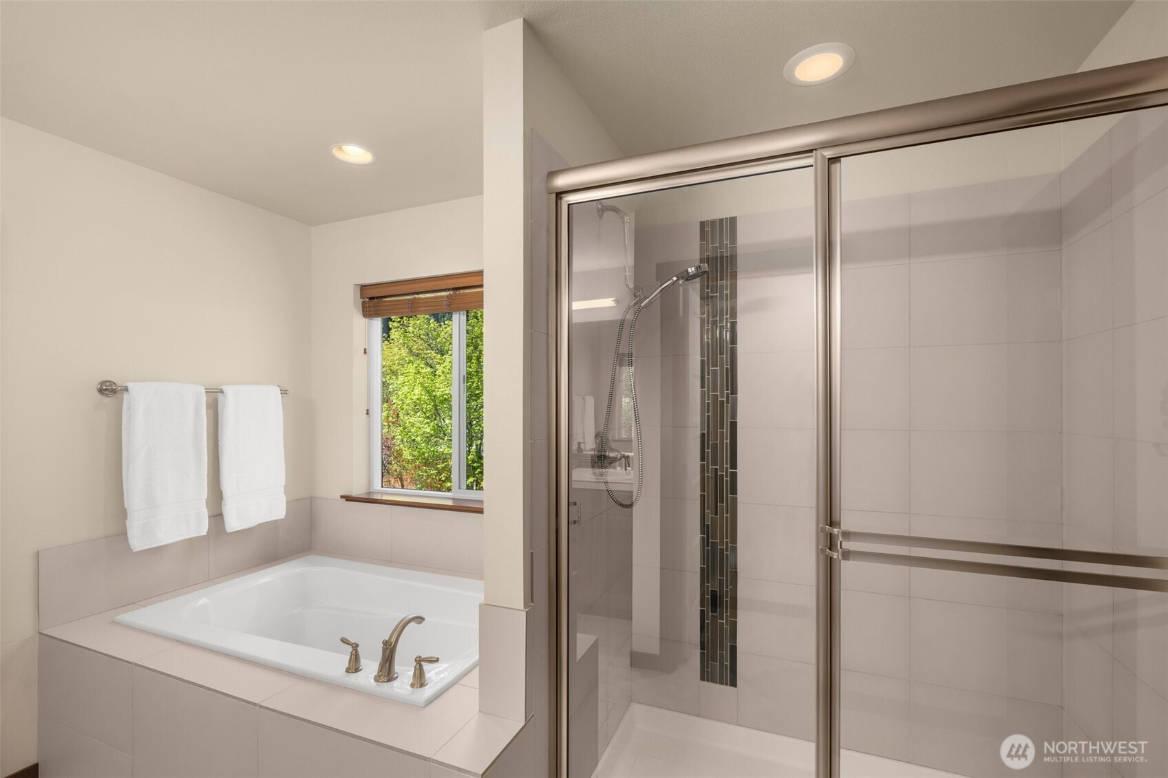 4610 Maltby Road Bothell, WA 98021 - Photo 20 of 39 a bathroom with a bathtub and a shower