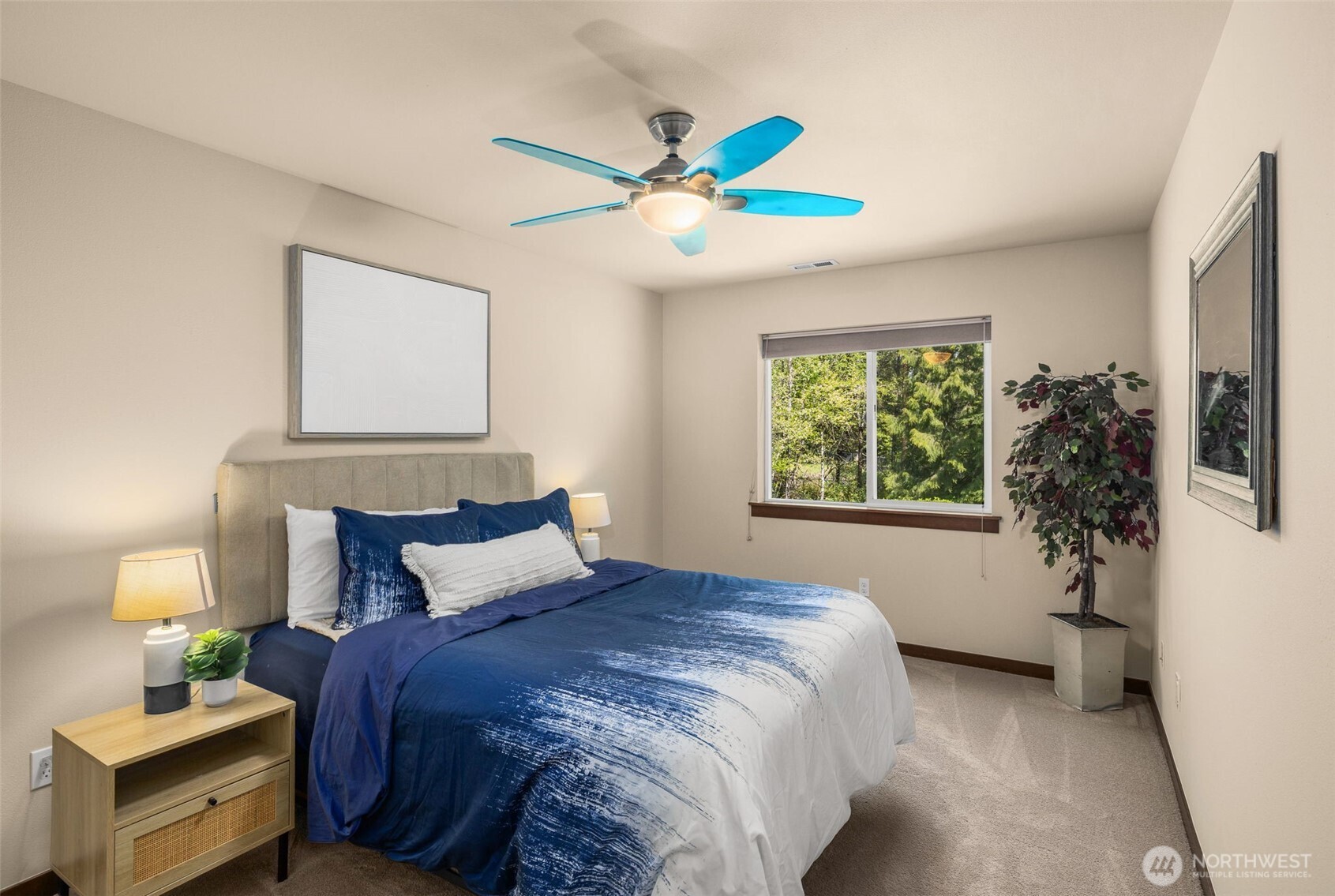 4610 Maltby Road Bothell, WA 98021 - Photo 21 of 39 a bedroom with a bed and a chandelier