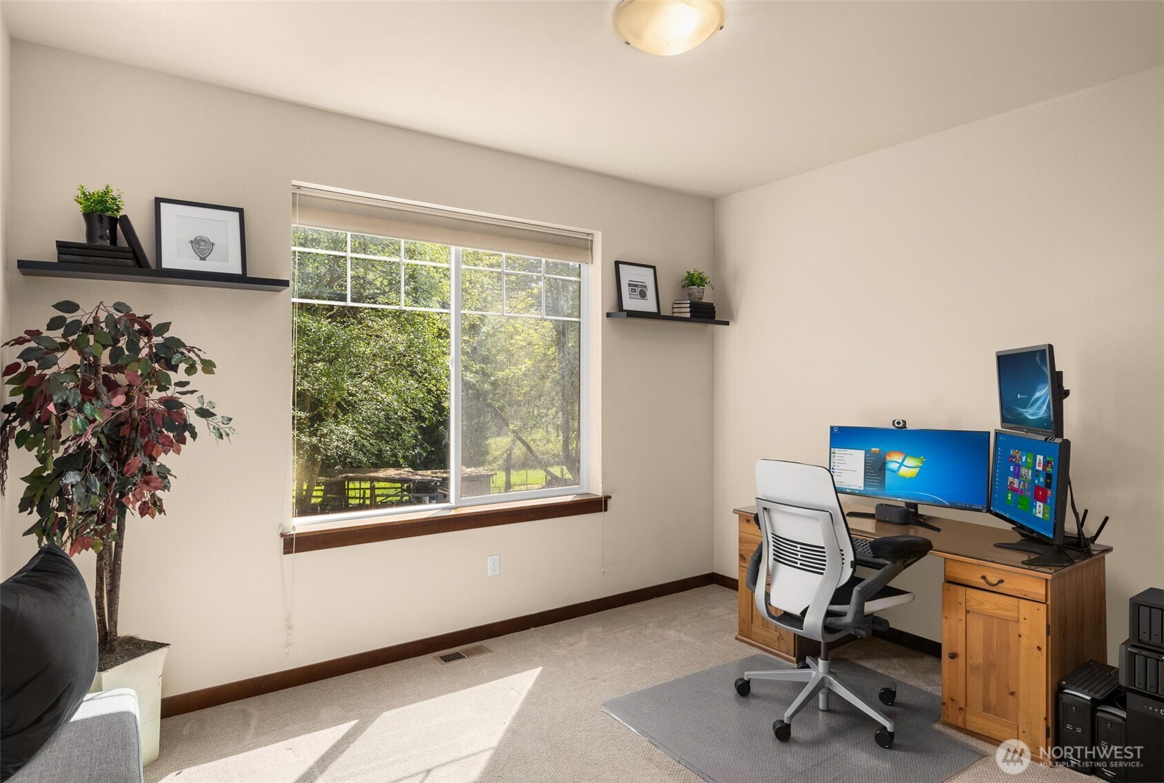 4610 Maltby Road Bothell, WA 98021 - Photo 26 of 39 a view of a workspace with furniture and a window
