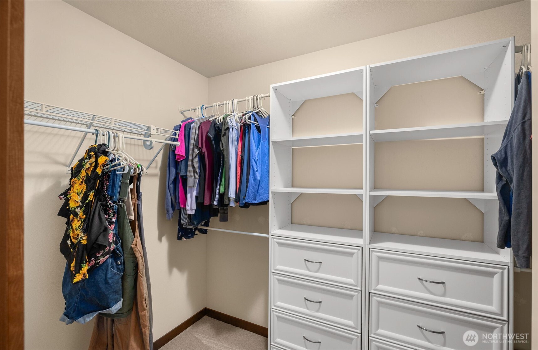 4610 Maltby Road Bothell, WA 98021 - Photo 28 of 39 a view of walk in closet with clothes and shoes