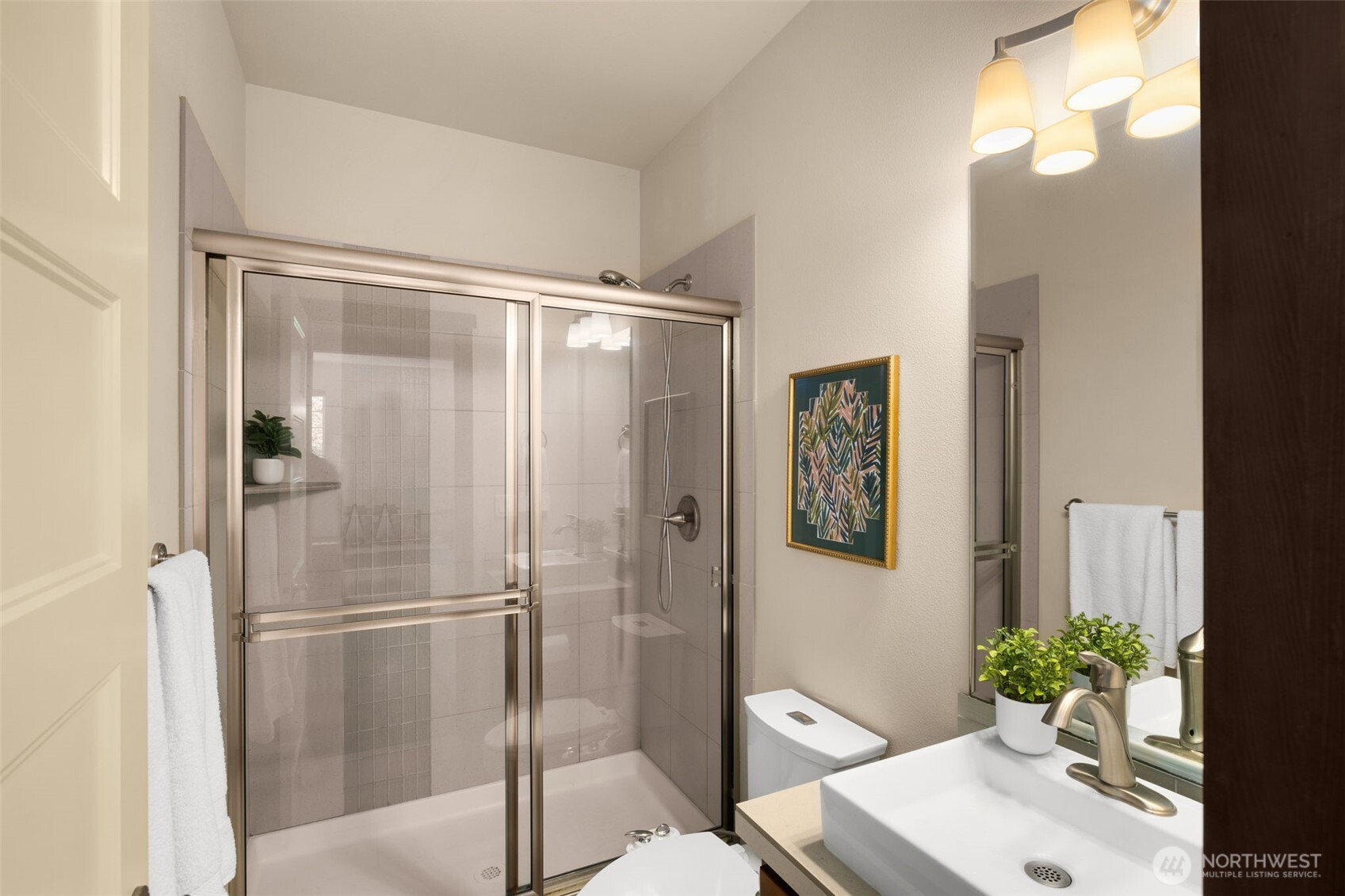 4610 Maltby Road Bothell, WA 98021 - Photo 31 of 39 a bathroom with a shower sink vanity and toilet