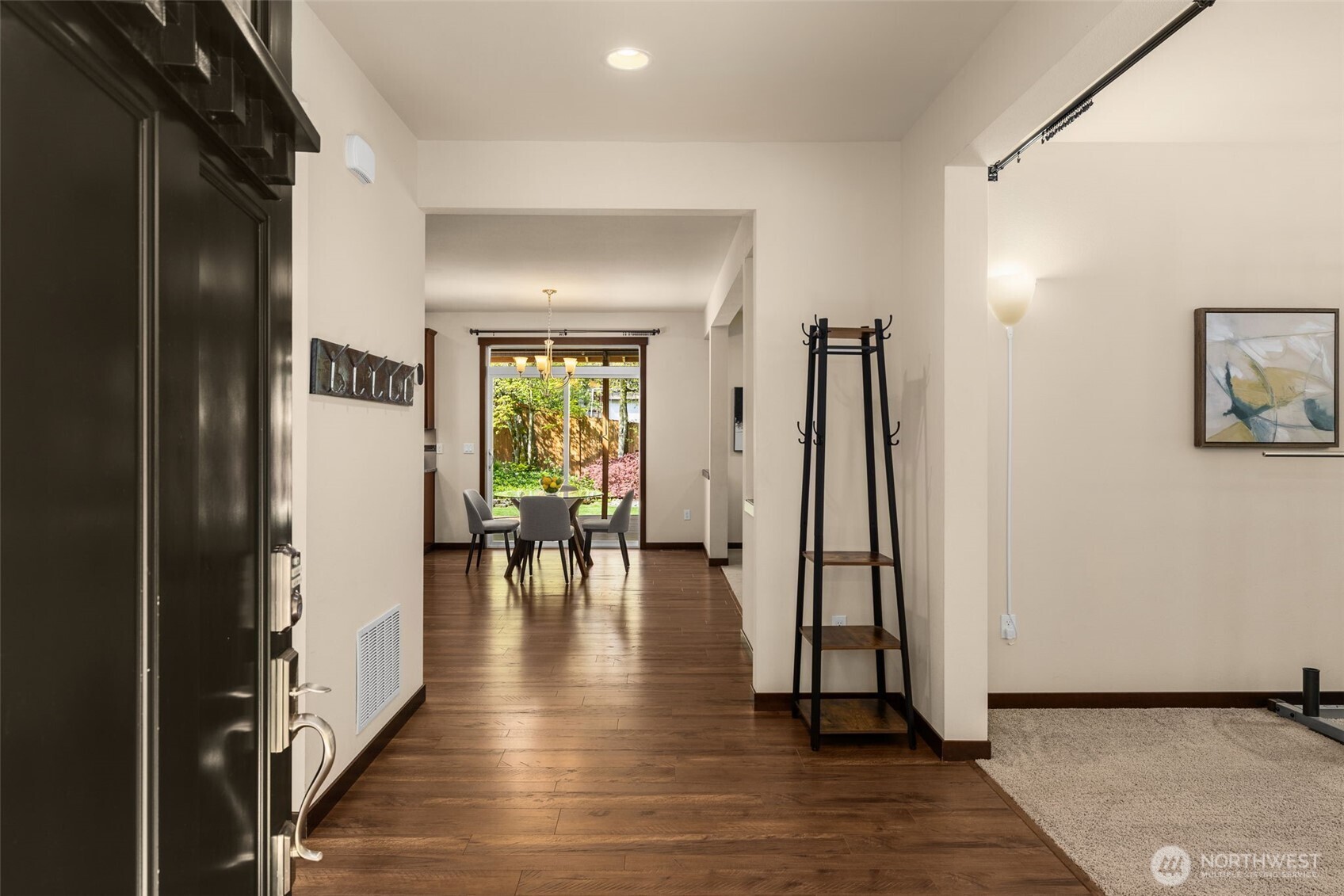 4610 Maltby Road Bothell, WA 98021 - Photo 4 of 39 a view of an entryway with wooden floor and a livingroom view