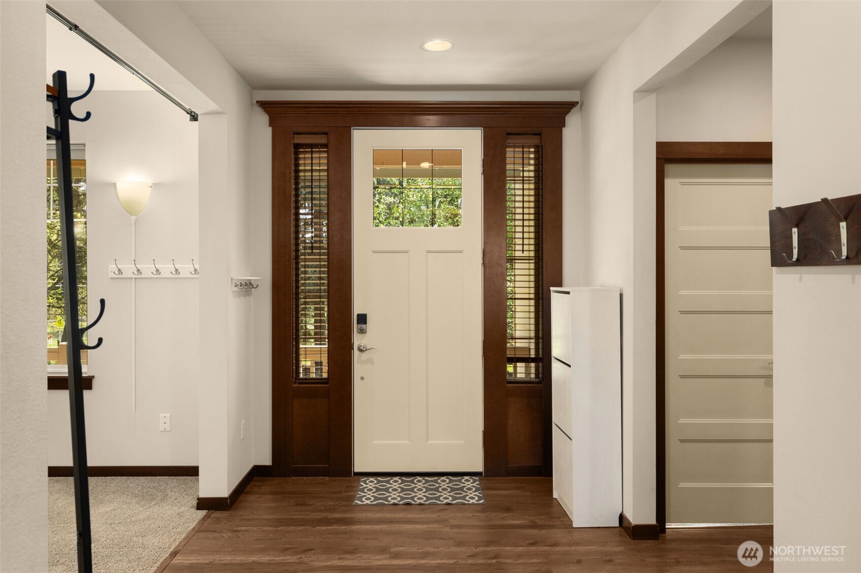 4610 Maltby Road Bothell, WA 98021 - Photo 5 of 39 a view of a hallway with wooden floor and windows