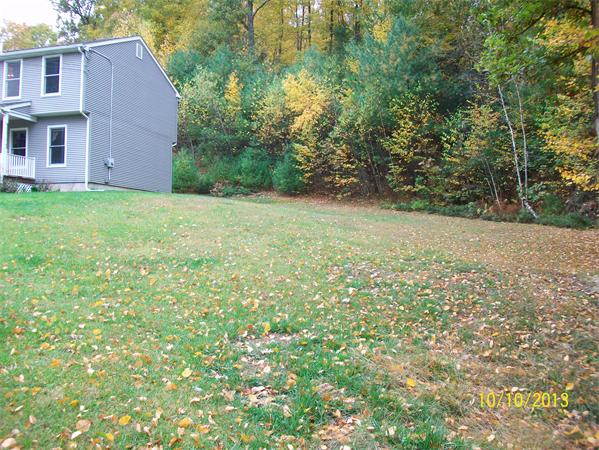 125 Bacon Road Ware, MA 01082 - Photo 4 of 30 a view of a house with a yard