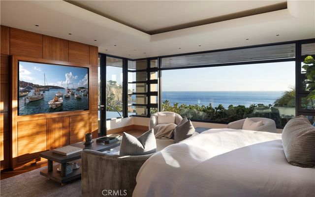 a balcony with furniture and a potted plant