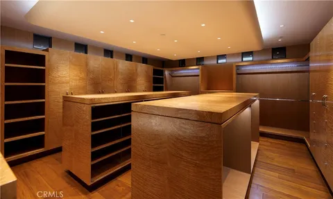 a kitchen with stainless steel appliances kitchen island granite countertop a sink and cabinets