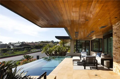 a terrace with a table and chairs