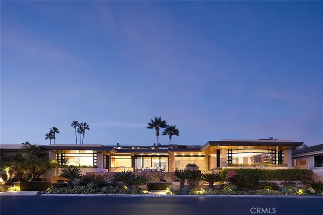 a front view of a house with a porch and a fireplace