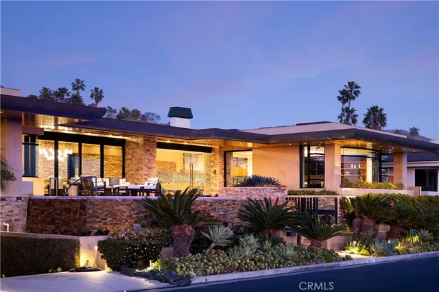 a view of a swimming pool with outdoor seating