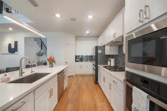 a view of a dining room with furniture windows and wooden floor