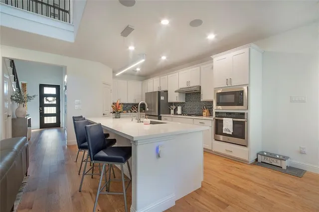 a kitchen with a sink cabinets and window