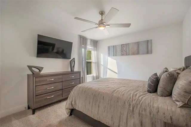a work room with furniture and a flat screen tv