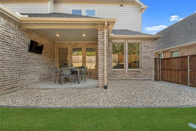 a bedroom with a bed and a ceiling fan