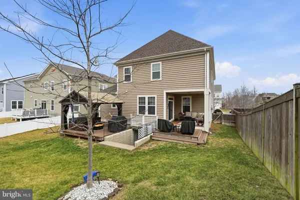 a view of a patio with wooden floor