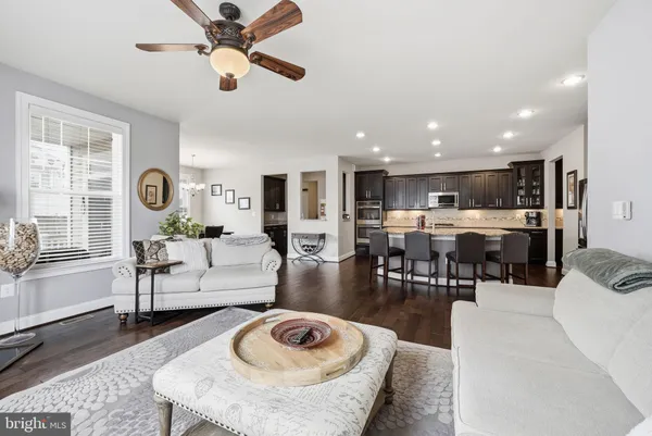 a kitchen with a stove a sink and a microwave