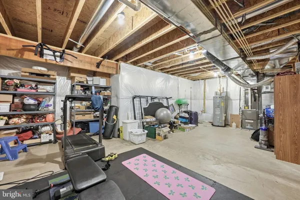 a bedroom with a bed a walk in closet and a large window