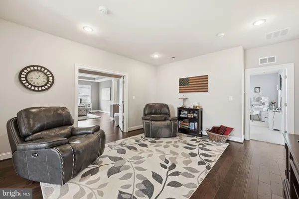 a bathroom with a sink a mirror a toilet and a mirror