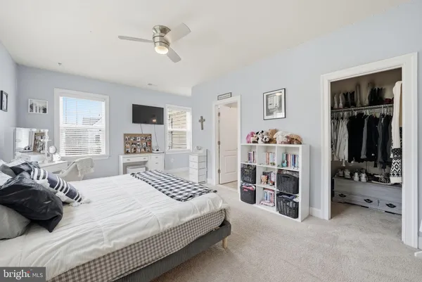 a spacious bathroom with a granite countertop tub sink and a mirror