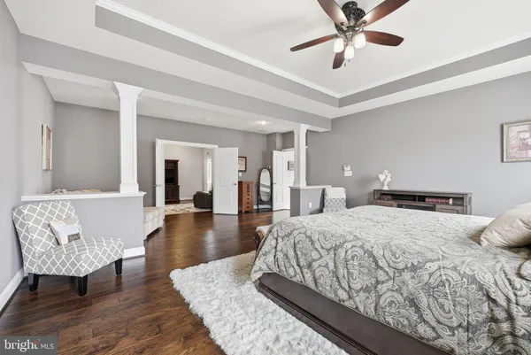 a view of roof deck with table and chairs couches and potted plants