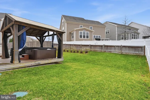 a front view of a house with a garden and deck