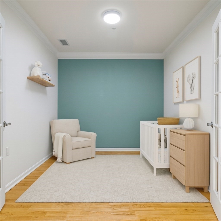 170 Clocktower Drive, Unit 5103 Waltham, MA 02452 - Photo 17 of 29 a room with a couch and a table in it